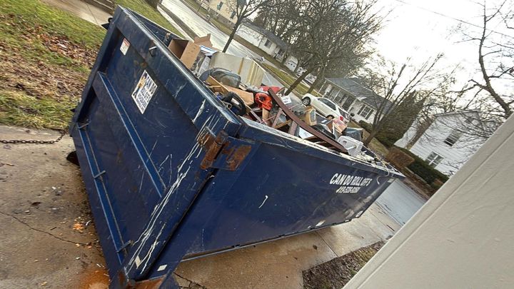 Roll-off dumpster loaded during an estate clean out (Estate Clean Out) by Affordable Moving Solutions of Ohio