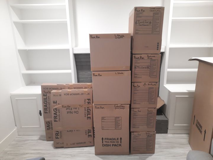 Packed moving boxes stacked in a room (Packing services) by Affordable Moving Solutions of Ohio
