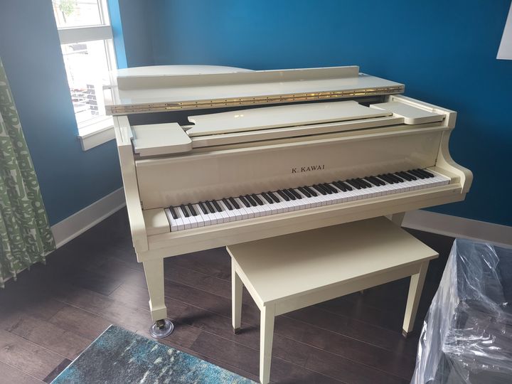 White baby grand piano in a home (Piano Moving) by Affordable Moving Solutions of Ohio
