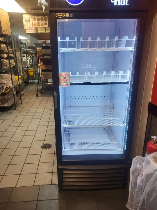 Glass-door commercial refrigerator delivered to a store (Pickup and delivery services) by Affordable Moving Solutions of Ohio
